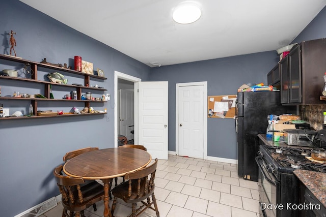 dining room featuring light tile patterned flooring