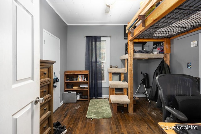 bedroom featuring ornamental molding and dark hardwood / wood-style floors