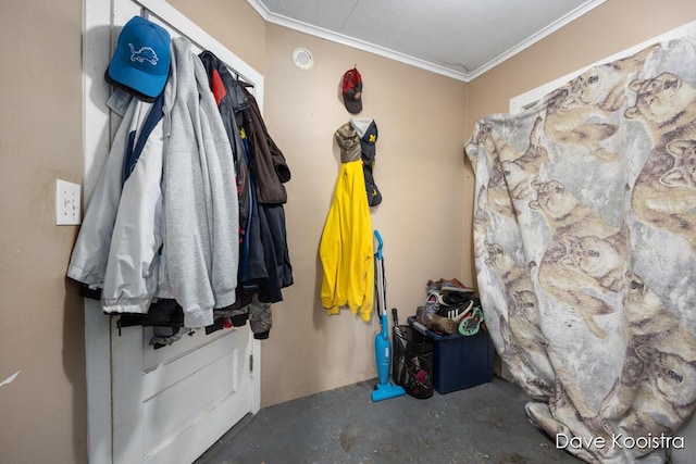 mudroom featuring ornamental molding and concrete flooring