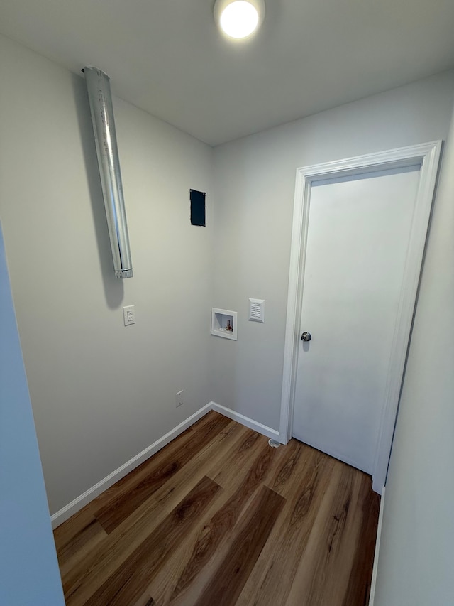 clothes washing area featuring hookup for a washing machine and wood-type flooring