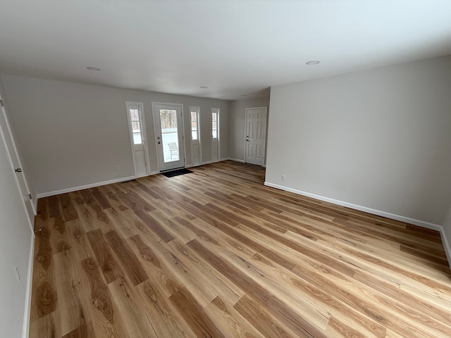 entryway with light hardwood / wood-style floors