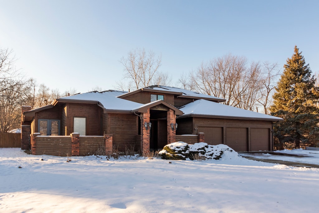 prairie-style house featuring a garage