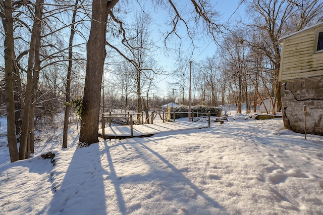 view of yard layered in snow