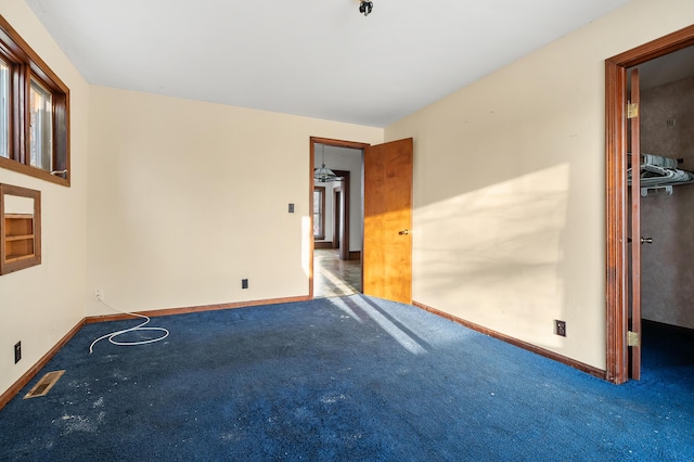 unfurnished room with carpet flooring