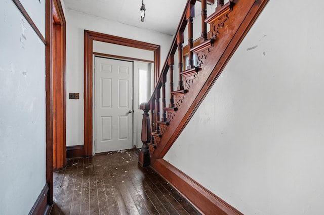 foyer with dark hardwood / wood-style floors