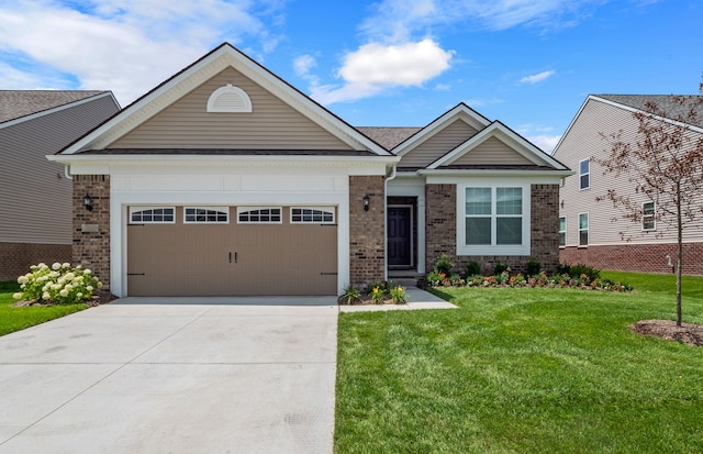 view of front of property with a front lawn and a garage