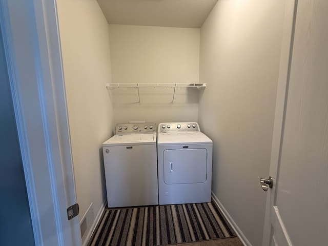 washroom with washing machine and dryer