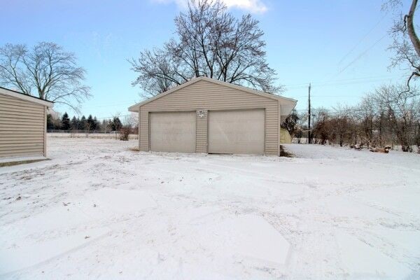 view of snow covered garage