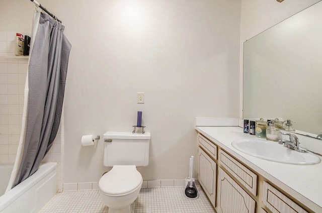 full bathroom featuring shower / bathtub combination with curtain, vanity, tile patterned floors, and toilet