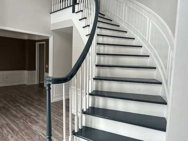 stairway featuring hardwood / wood-style floors