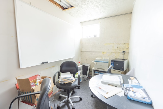 office with a textured ceiling