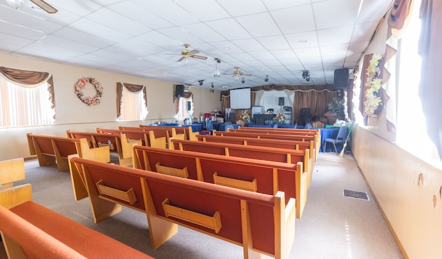 miscellaneous room featuring a paneled ceiling and ceiling fan