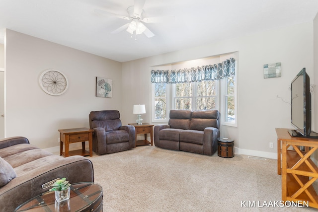 carpeted living room featuring ceiling fan