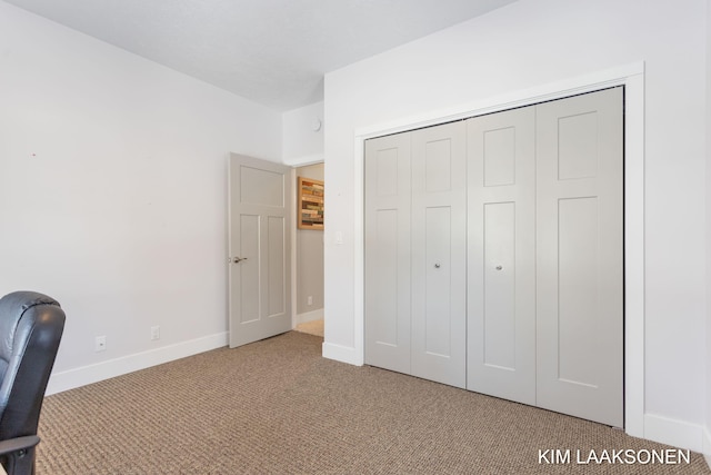 unfurnished office featuring light colored carpet