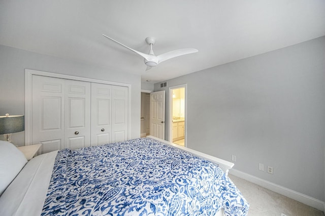 bedroom featuring carpet, ceiling fan, and a closet