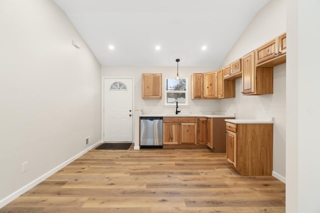 kitchen with dishwasher, sink, hanging light fixtures, light hardwood / wood-style flooring, and lofted ceiling