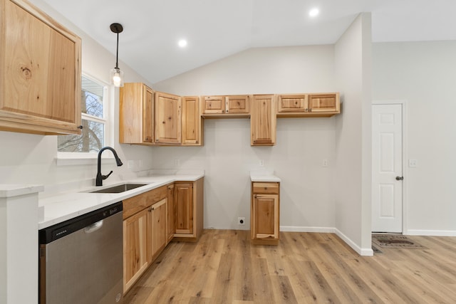 kitchen featuring stainless steel dishwasher, sink, light hardwood / wood-style flooring, hanging light fixtures, and lofted ceiling