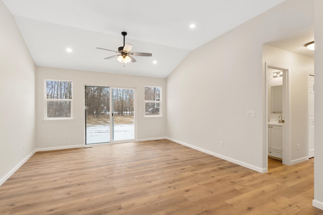 empty room featuring baseboards, ceiling fan, vaulted ceiling, light wood-style floors, and recessed lighting