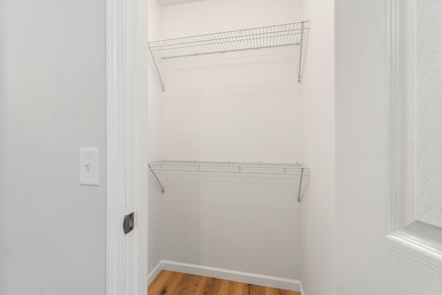 spacious closet featuring hardwood / wood-style floors