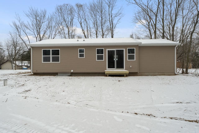 view of snow covered house