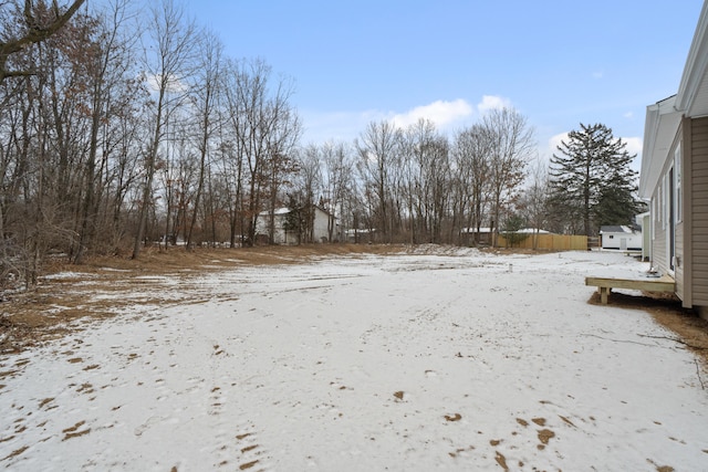 view of yard layered in snow