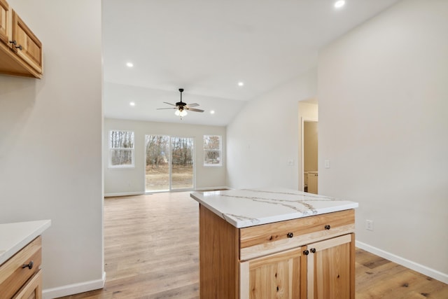 kitchen with ceiling fan, light countertops, light wood finished floors, and recessed lighting