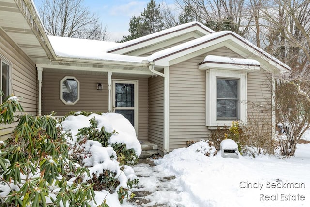 view of snow covered property