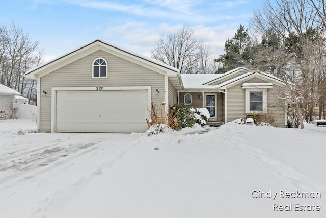 ranch-style home with a garage