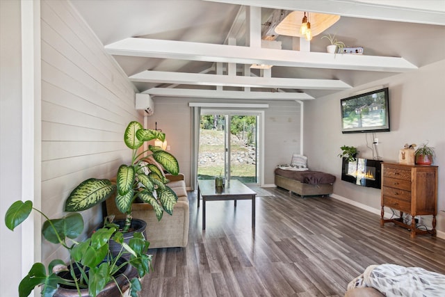 living room featuring wood-type flooring, lofted ceiling with beams, and a wall mounted air conditioner