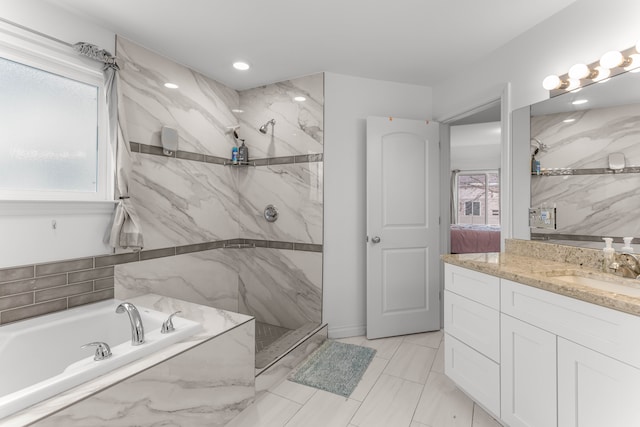 bathroom with vanity and plus walk in shower