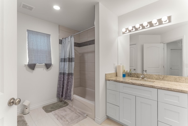 bathroom with shower / bath combo and vanity