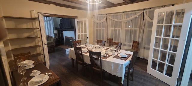 dining room featuring french doors, dark hardwood / wood-style floors, and beam ceiling