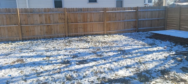 view of yard layered in snow