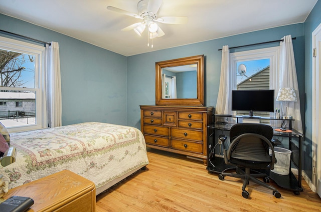 bedroom featuring ceiling fan and light hardwood / wood-style flooring