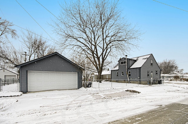 exterior space featuring a garage and an outdoor structure