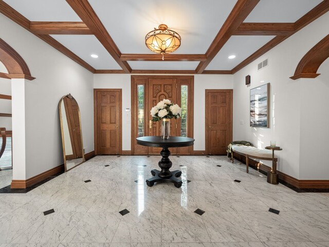 foyer featuring beam ceiling, crown molding, and coffered ceiling