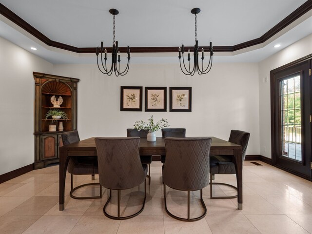 tiled dining space with a notable chandelier, crown molding, and a tray ceiling