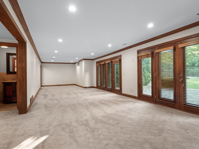 carpeted empty room featuring ornamental molding