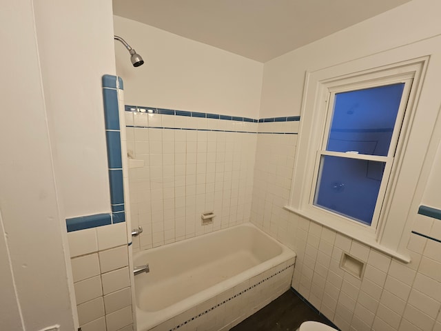 bathroom with tile walls