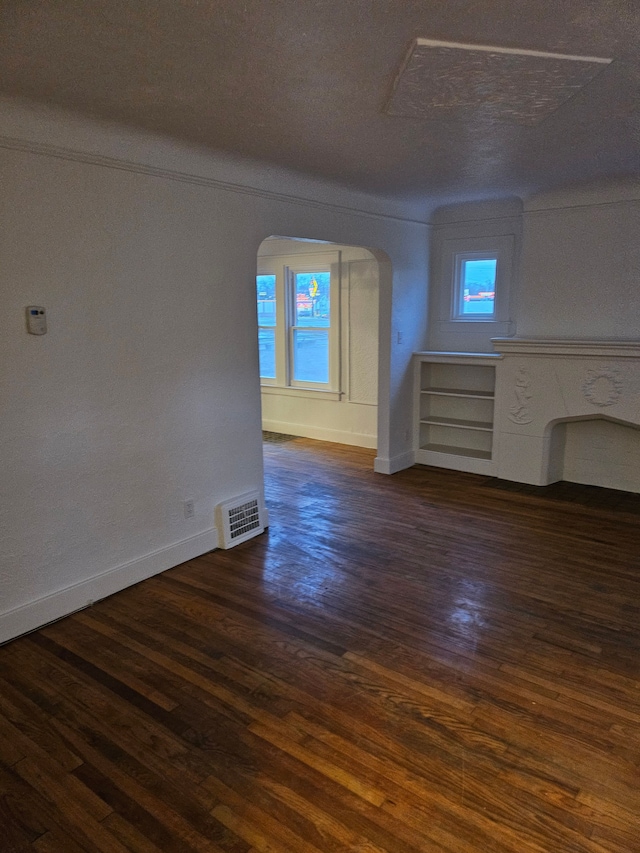 empty room featuring dark hardwood / wood-style flooring