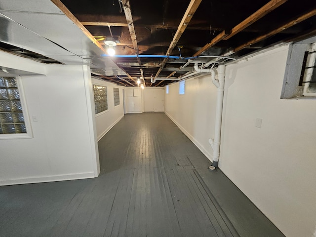 basement featuring dark hardwood / wood-style flooring