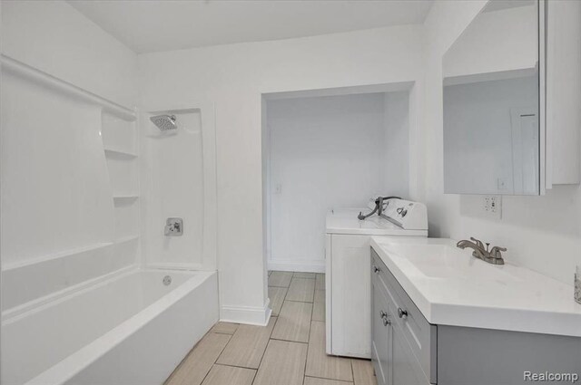 bathroom featuring vanity and shower / bathtub combination