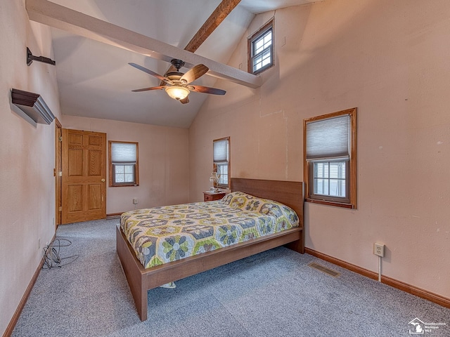 bedroom with carpet floors, ceiling fan, beamed ceiling, and high vaulted ceiling