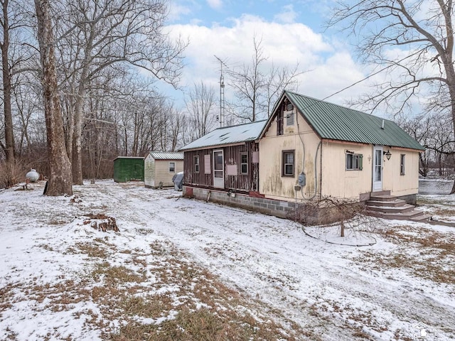 exterior space with a storage shed