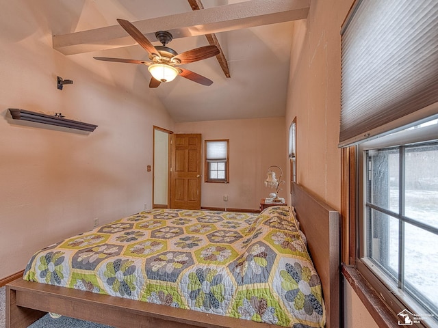 bedroom featuring ceiling fan and lofted ceiling with beams