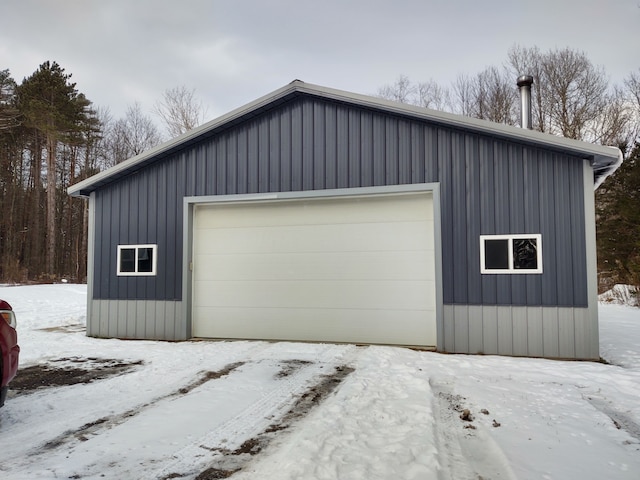 view of snow covered garage