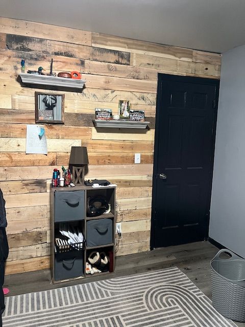 interior space featuring wood walls