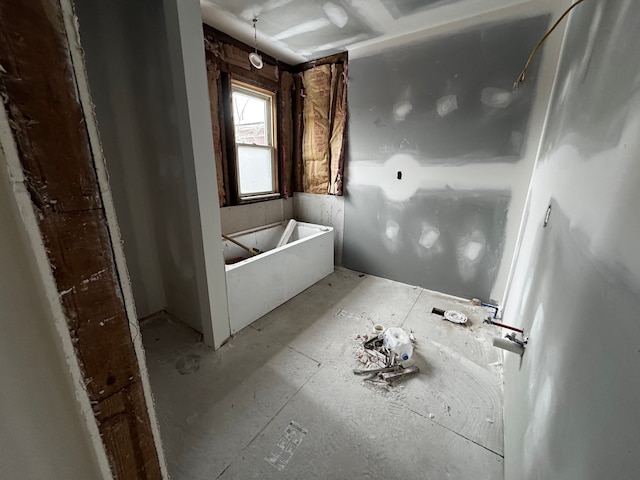 bathroom featuring a tub to relax in