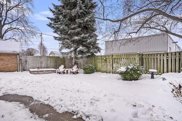 view of yard covered in snow