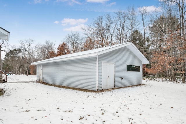 view of snow covered garage